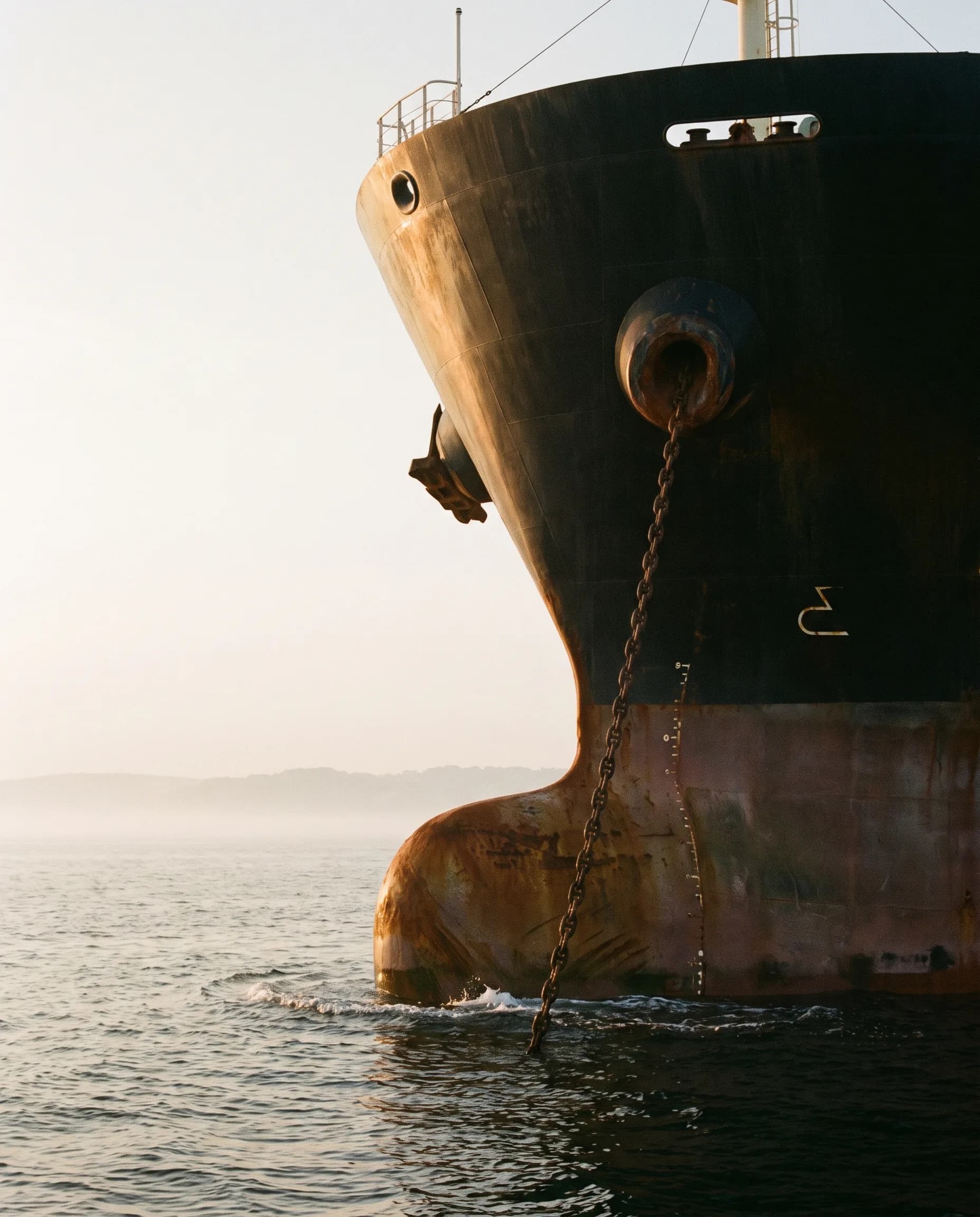 A ship's bow at golden hour